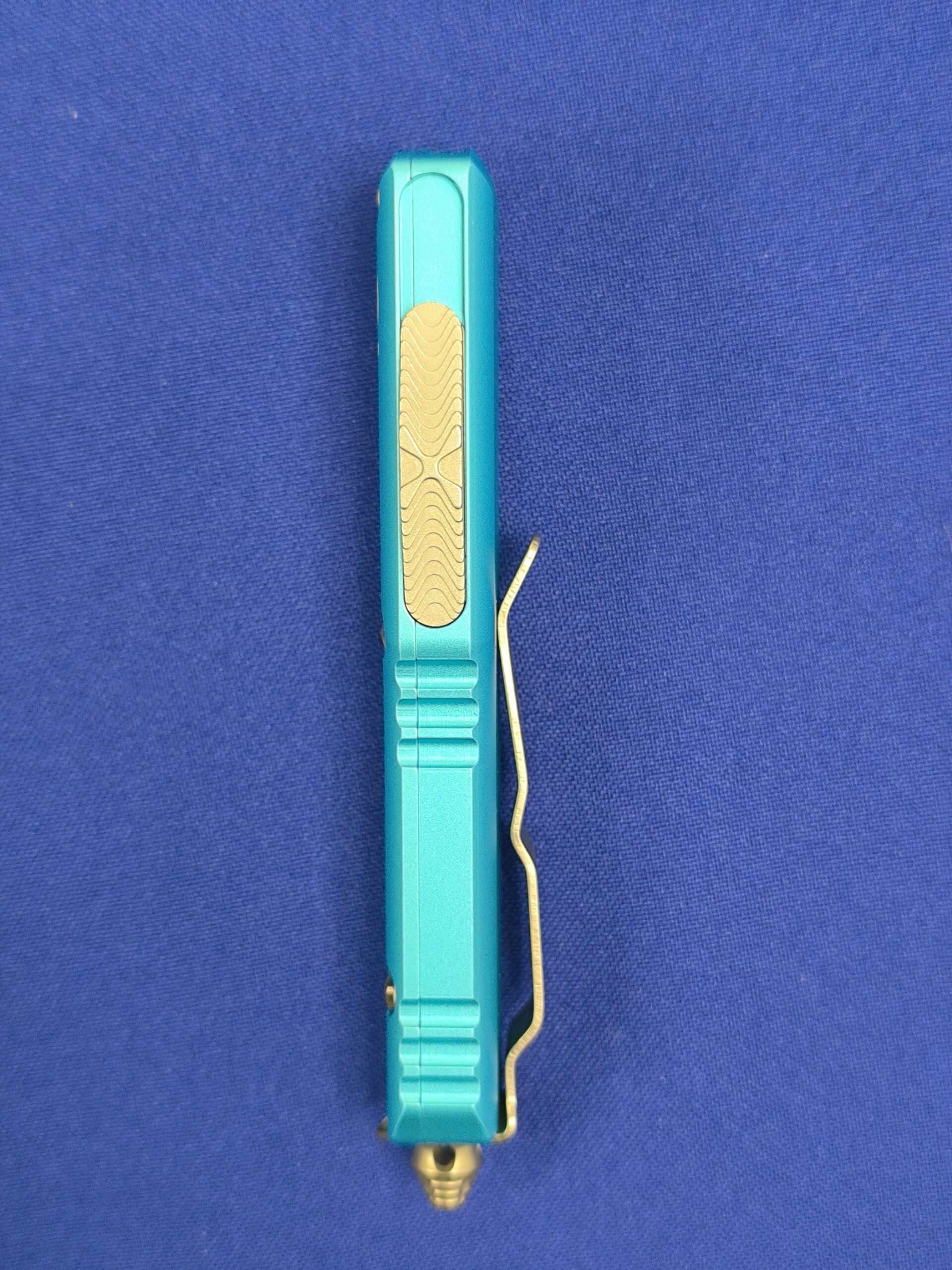 Фронтальный нож Microtech UTX-85 T/E Turguoise 233-12 TQ, сталь M390