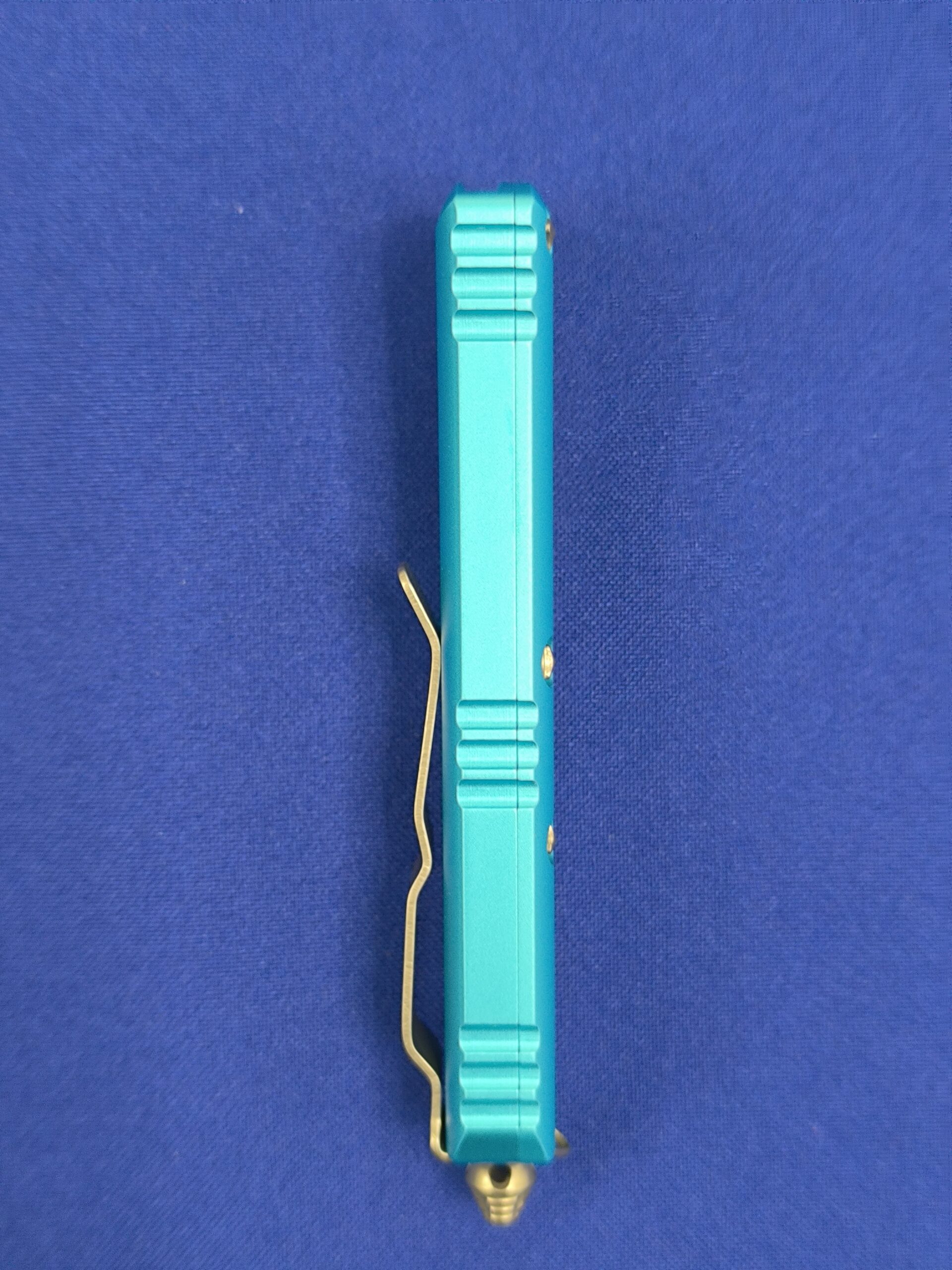 Фронтальный нож Microtech UTX-85 T/E Turguoise 233-12 TQ, сталь M390